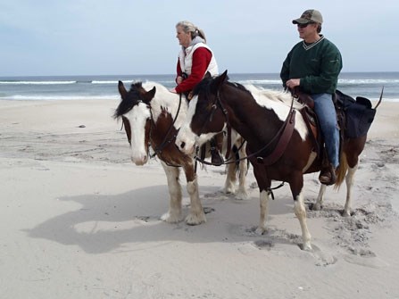 2 campers on horses